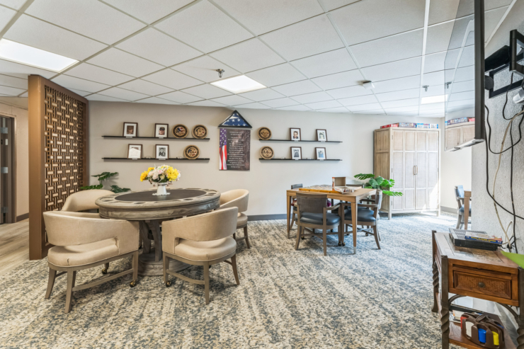 A warm community space featuring cozy seating, cheerful decor, and inviting areas for socializing.