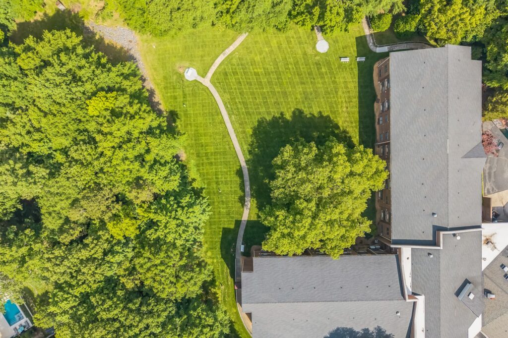Lush greenery surrounds inviting pathways, creating a serene and welcoming atmosphere for all residents.