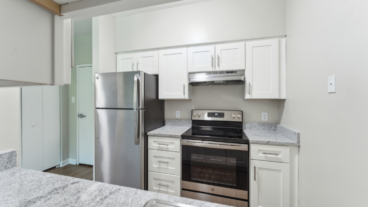 Bright and inviting kitchen, featuring modern appliances and ample counter space for joyful gatherings.