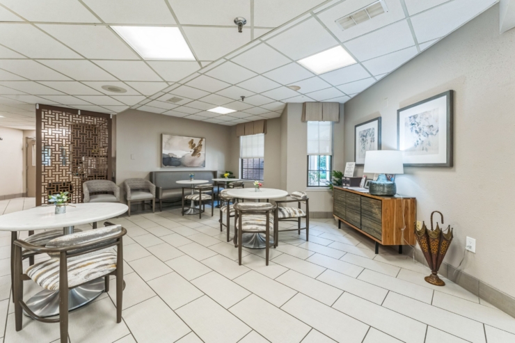 A welcoming lounge filled with natural light, inviting seating, and vibrant decor, fostering community and comfort.