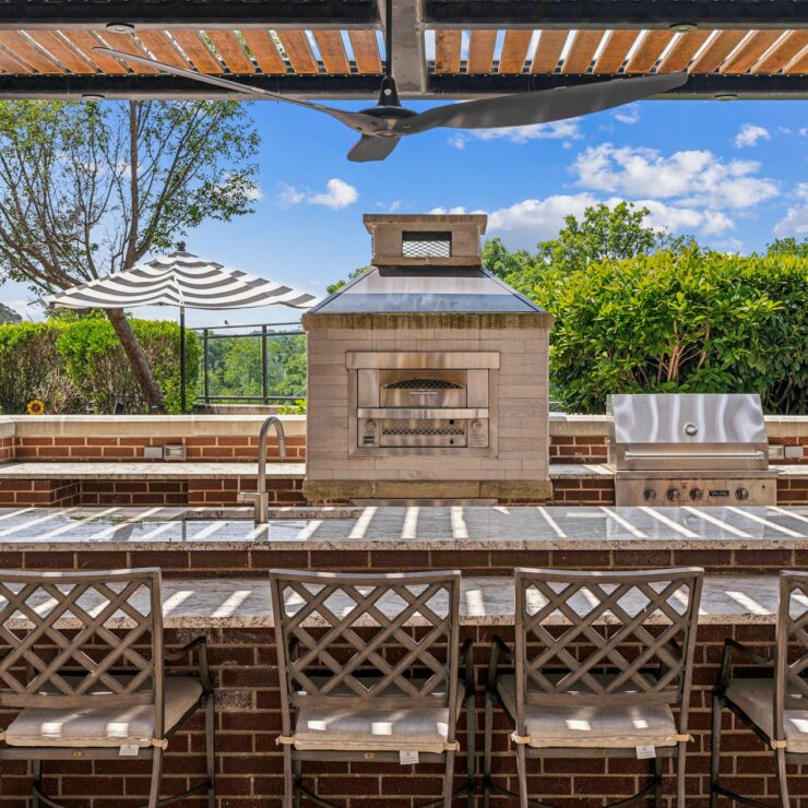 A welcoming outdoor space featuring a barbecue area, perfect for gatherings and relaxation.