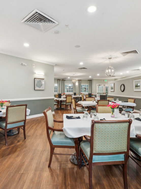 A welcoming dining area filled with natural light, inviting decor, and cheerful table settings.
