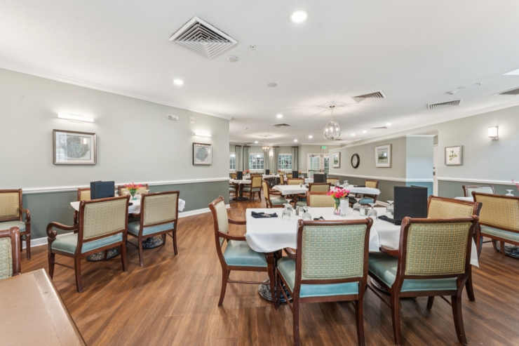 A welcoming dining area filled with natural light, inviting decor, and cheerful table settings.