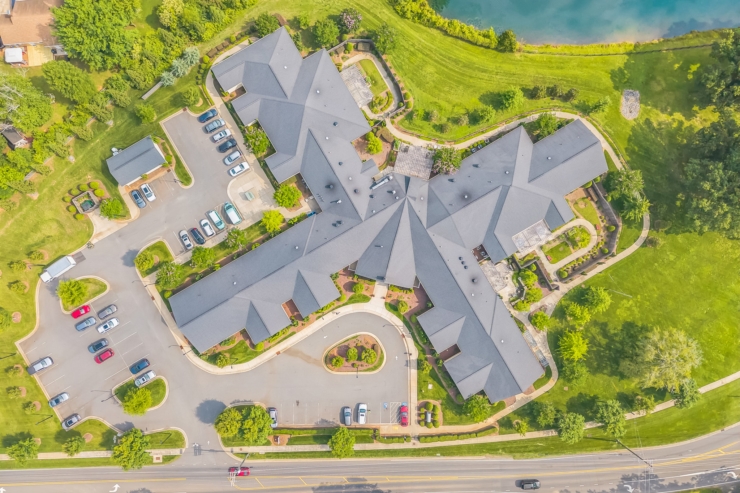 A welcoming community surrounded by lush greenery, offering comfort and connection for all residents.