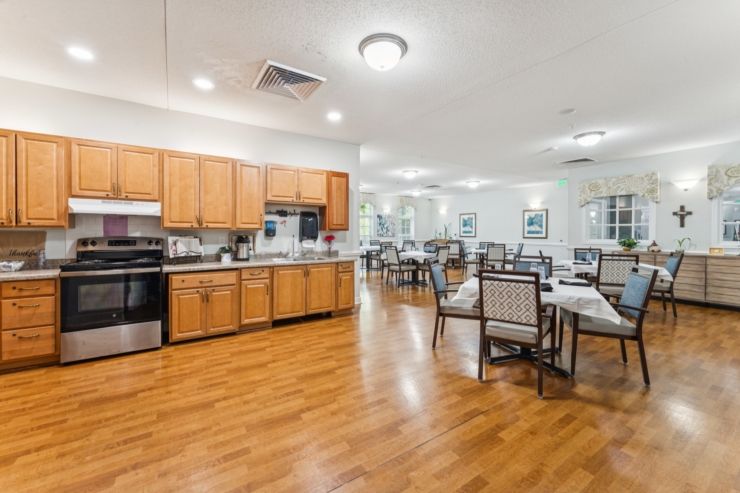 Bright, inviting dining area with warm wood accents, fostering a sense of community and comfort.
