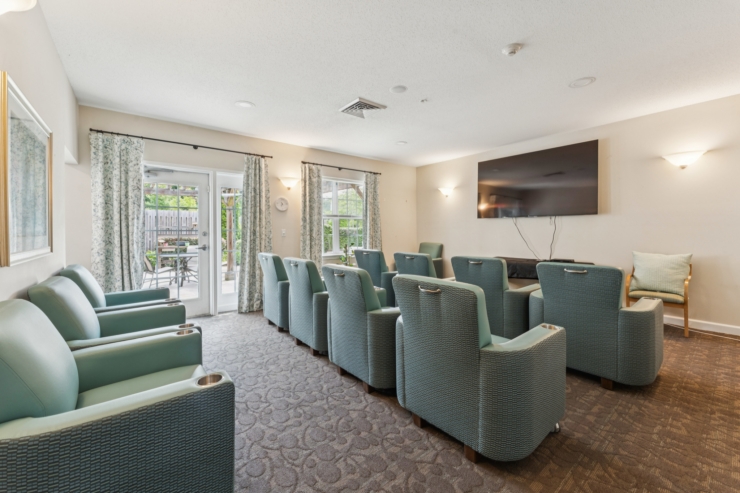 A welcoming lounge with comfortable seating, inviting natural light, and a serene outdoor view.