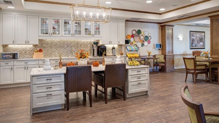 Bright, inviting bistro with comfortable seating and warm decor for residents to gather and relax.