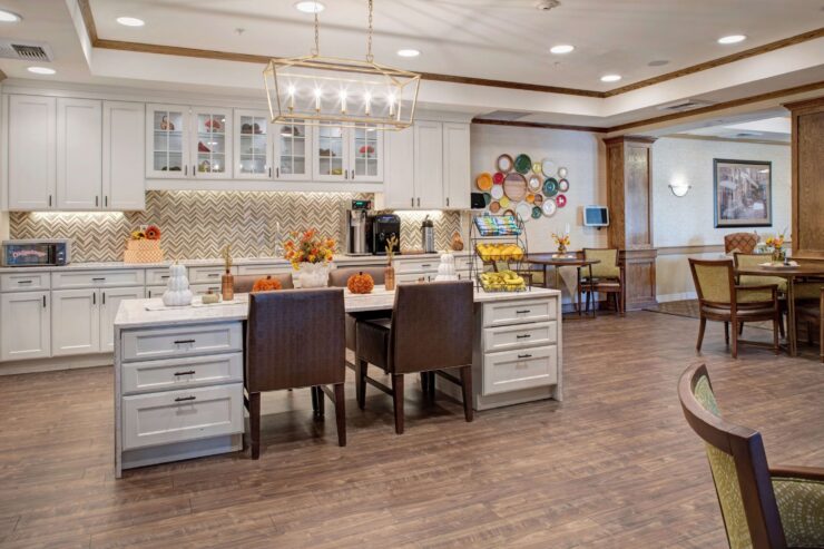 Bright, inviting bistro with comfortable seating and warm decor for residents to gather and relax.