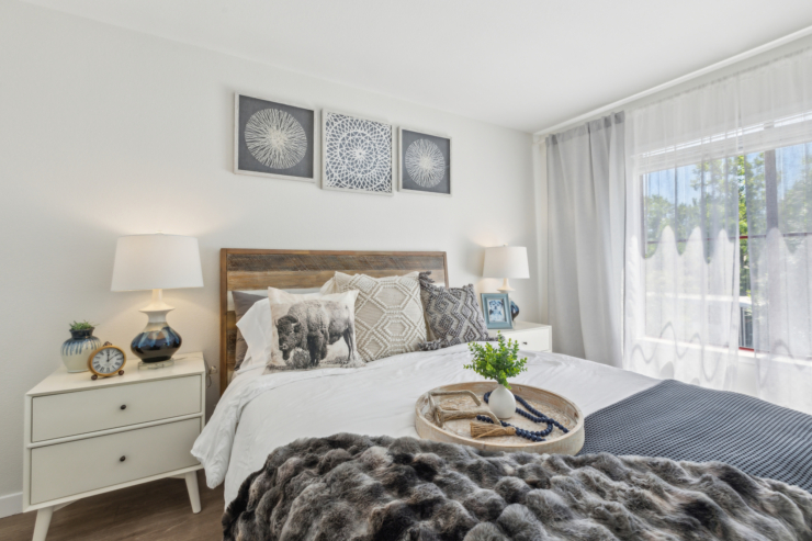 A cozy, inviting bedroom filled with natural light, perfect for relaxation and comfort.