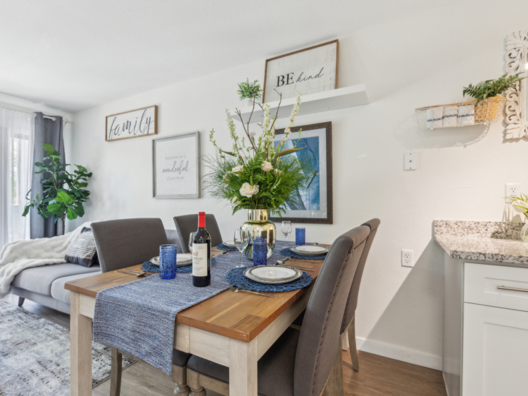 Inviting dining area with beautiful flowers, warm décor, and natural light, perfect for community gatherings.