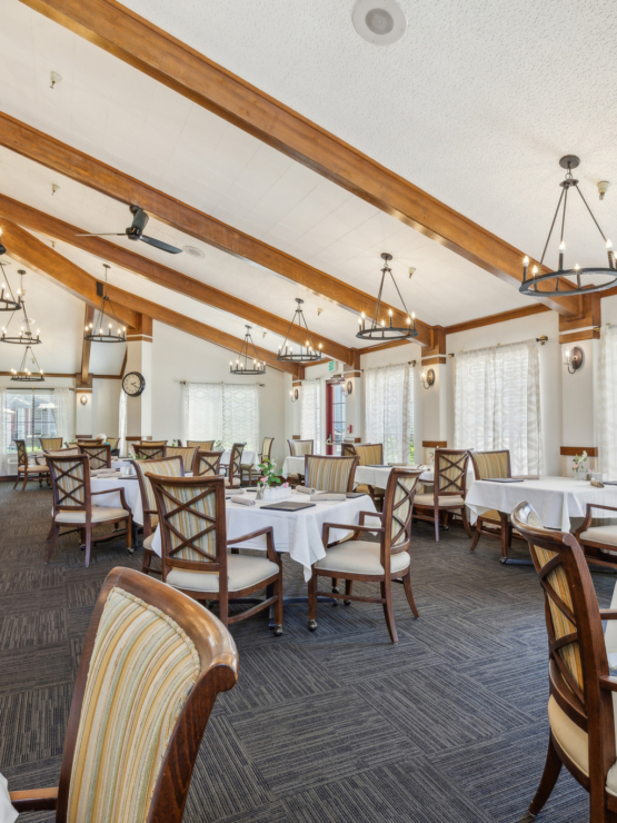 A welcoming dining area, featuring cozy seating, warm lighting, and a bright, inviting atmosphere.