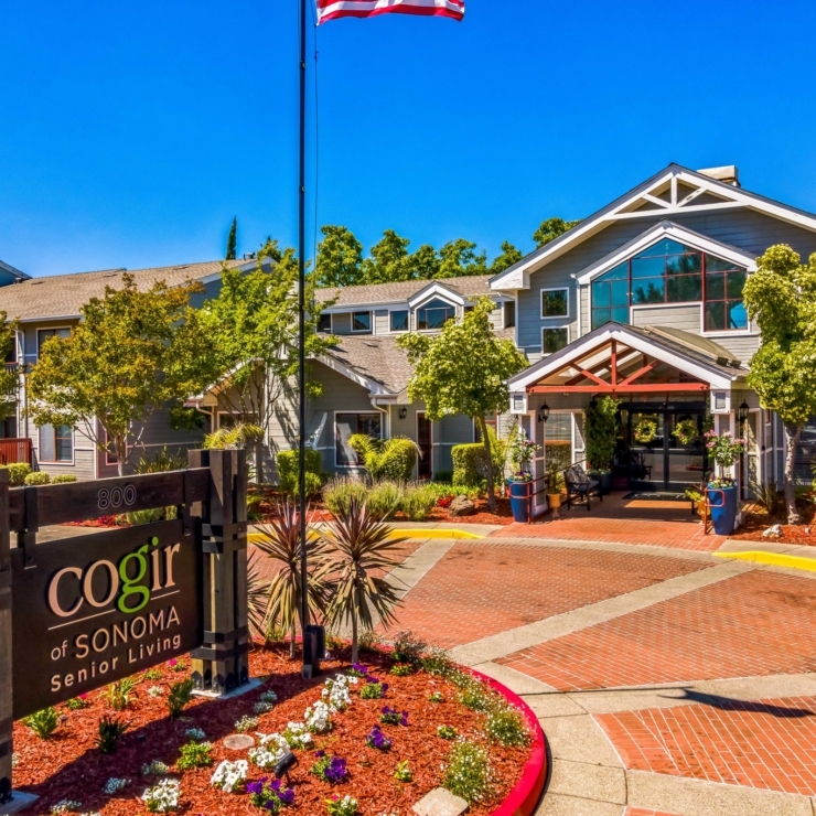 Nestled in vibrant greenery, this welcoming senior living community exudes warmth and connection.