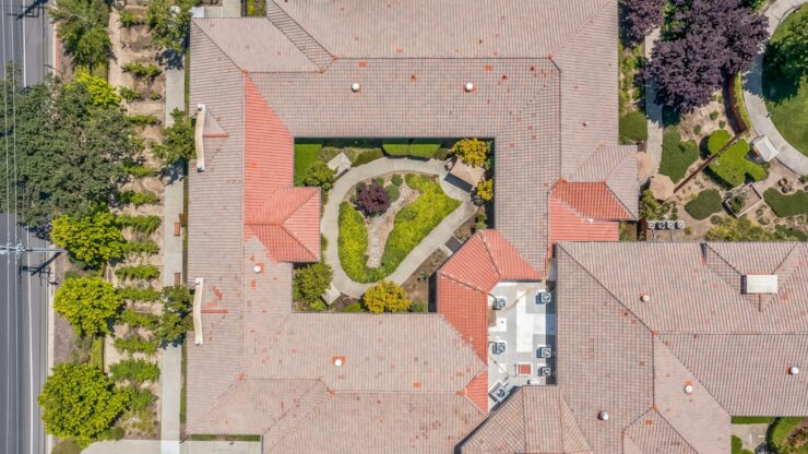 A welcoming community layout featuring lush gardens and pathways, perfect for socializing and relaxation.