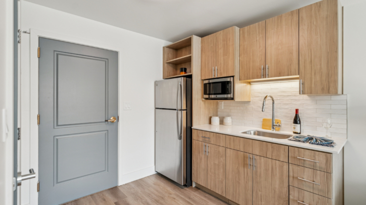 A bright, inviting kitchen showcases modern amenities, promoting warmth and community for residents.