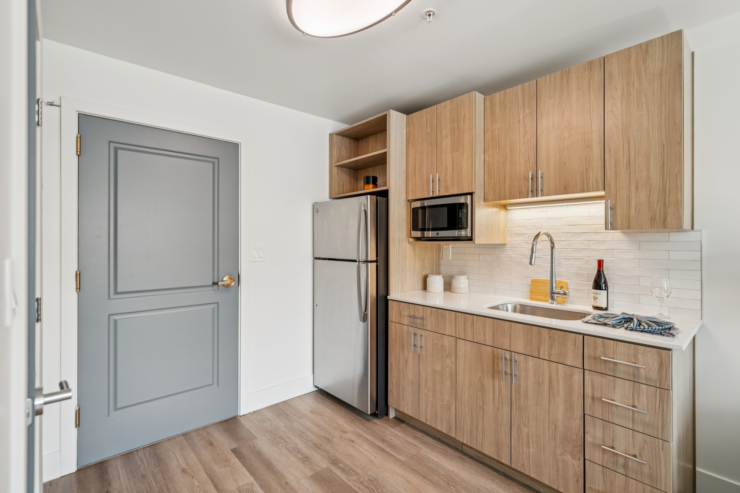 A bright, inviting kitchen showcases modern amenities, promoting warmth and community for residents.