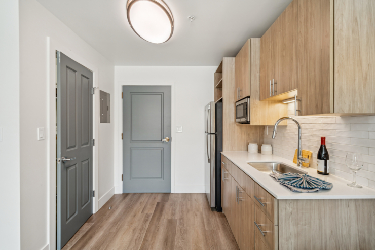 A bright, welcoming kitchen featuring modern finishes, inviting warmth, and a sense of home.