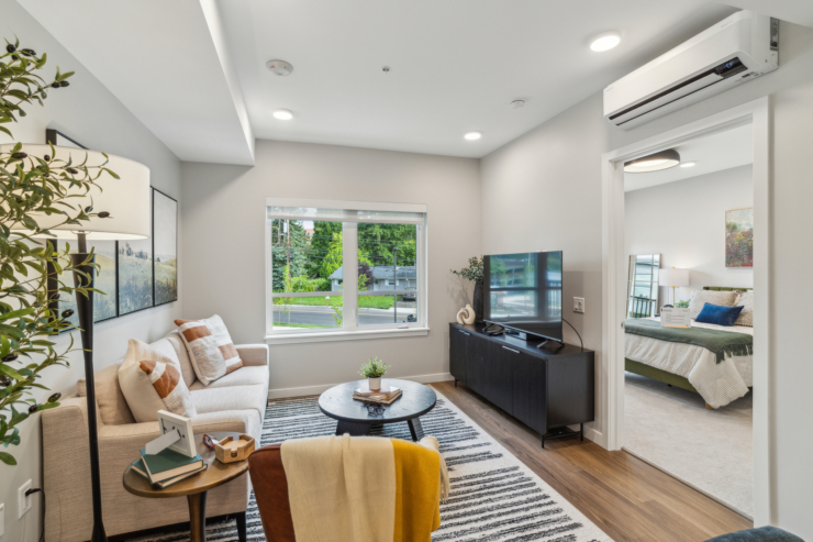 A cozy, inviting living space with natural light, perfect for relaxation and community gatherings.