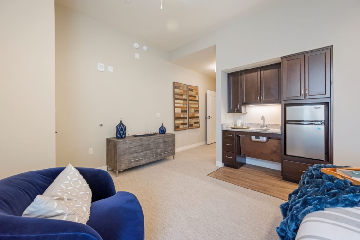 A welcoming, cozy space featuring soft colors, comfortable furnishings, and a sense of community.