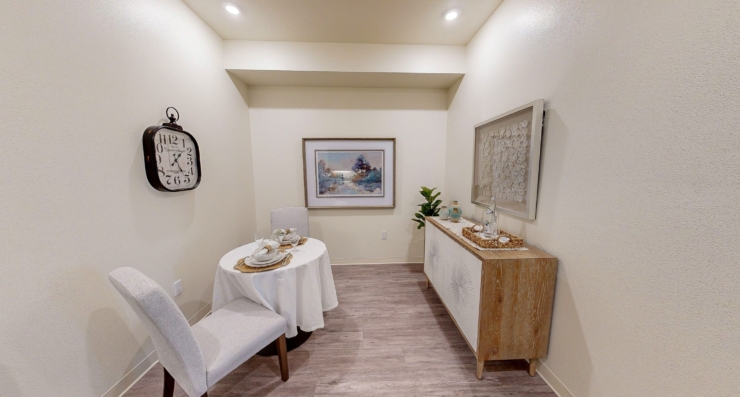 A serene dining nook with elegant decor invites warm gatherings and cherished moments.