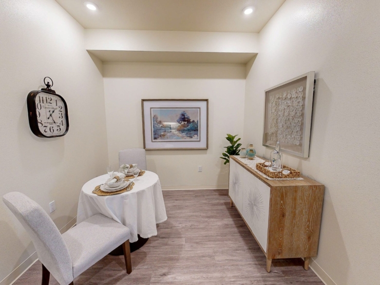 A serene dining nook with elegant decor invites warm gatherings and cherished moments.