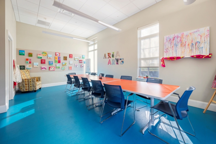 Bright and inviting space with colorful artwork, fostering creativity and community connections.