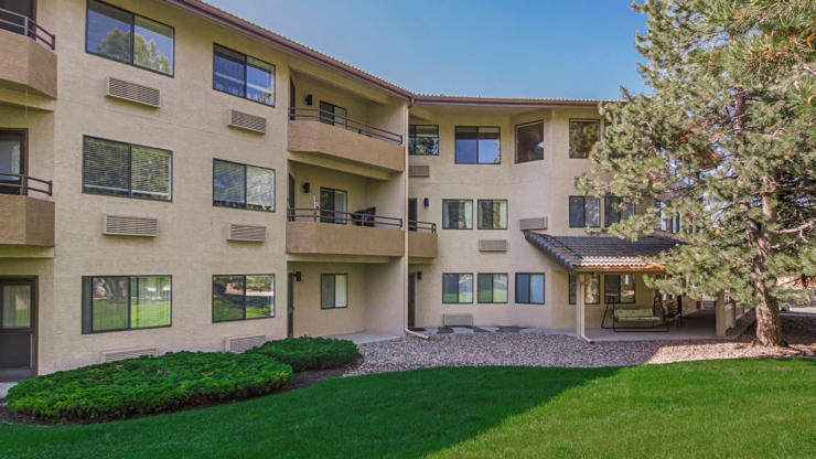 A welcoming residence surrounded by lush greenery, fostering a sense of community and comfort.