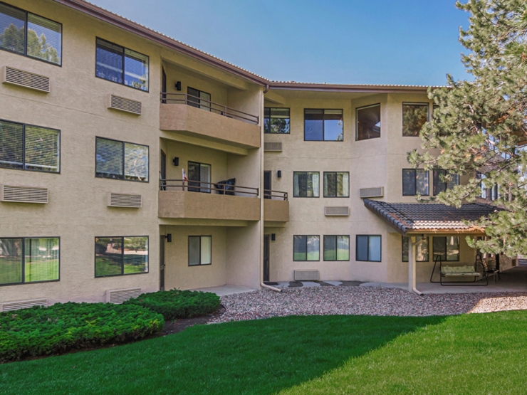 A welcoming residence surrounded by lush greenery, fostering a sense of community and comfort.