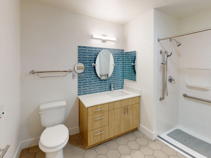 A bright, inviting bathroom featuring modern amenities, promoting comfort and safety for residents.