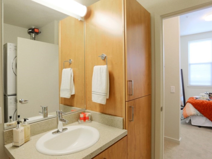 A cozy bathroom with warm wood accents, inviting comfort and a sense of community.