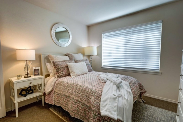 A serene bedroom filled with soft light, inviting decor, and personal touches for a warm, welcoming feel.