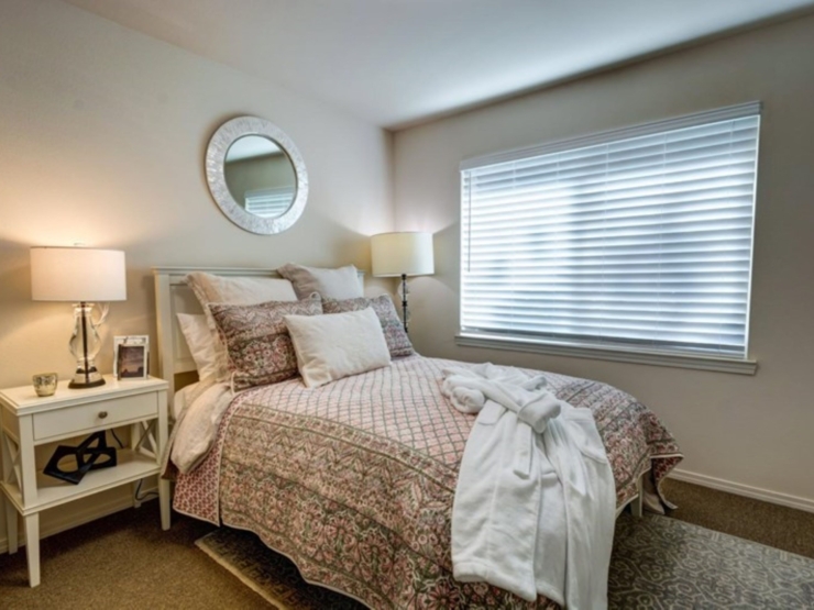 A serene bedroom filled with soft light, inviting decor, and personal touches for a warm, welcoming feel.