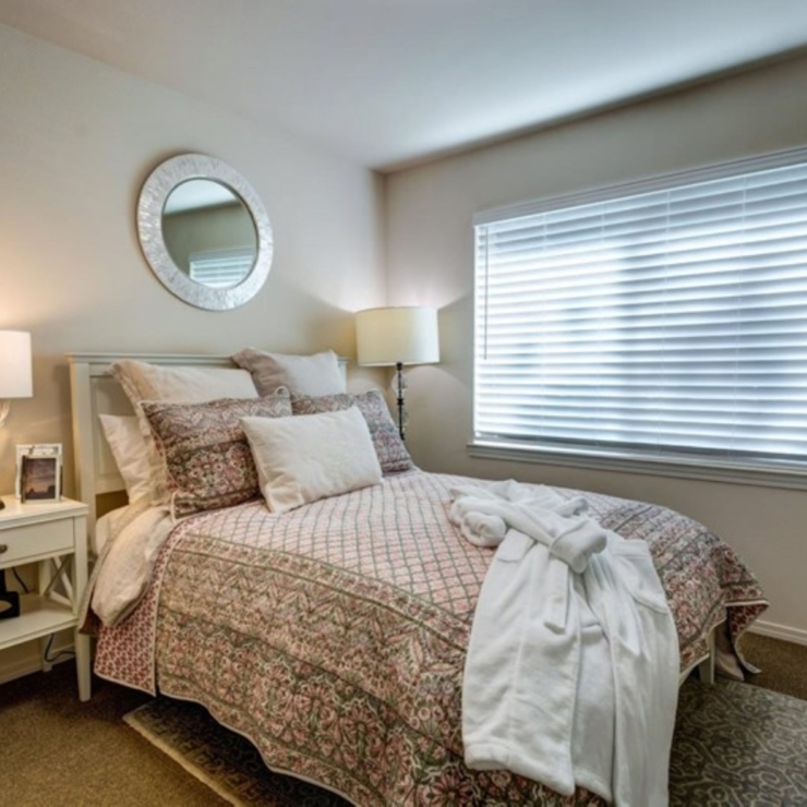 A serene bedroom filled with soft light, inviting decor, and personal touches for a warm, welcoming feel.