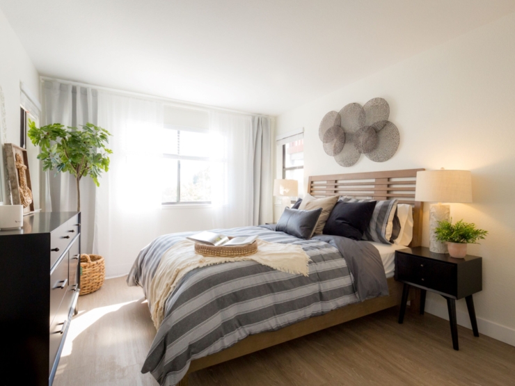 Bright and inviting, this serene bedroom exudes comfort and warmth, perfect for restful living.