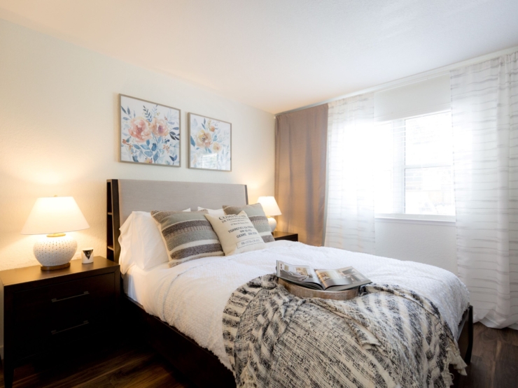 A cozy bedroom filled with warmth, featuring soft lighting, inviting decor, and a serene atmosphere.