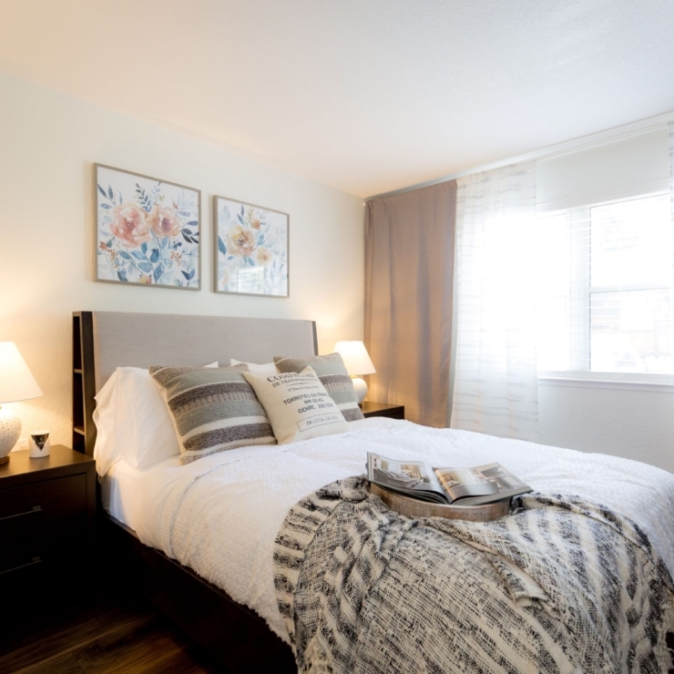 A cozy bedroom filled with warmth, featuring soft lighting, inviting decor, and a serene atmosphere.