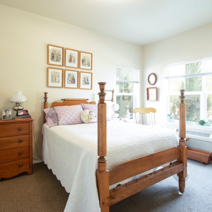 A bright, inviting bedroom filled with warmth, showcasing comfort and a sense of community.