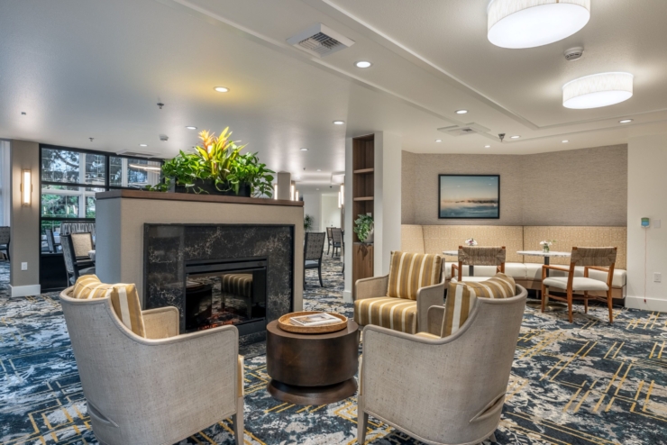 A cozy lounge area featuring comfortable seating, warm lighting, and inviting decor, fostering community.