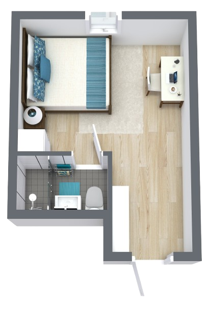 A cozy lounge area features comfortable seating, inviting decor, and bright, welcoming natural light.