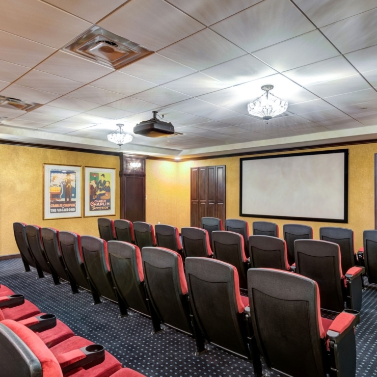 A welcoming theater space, warmly designed for shared movie nights and community gatherings.