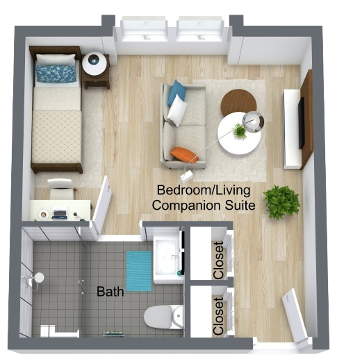 A bright, spacious room with warm wood flooring, inviting comfort and a sense of community.