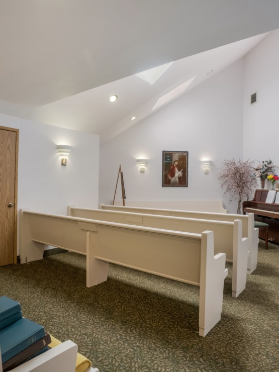 A serene gathering space filled with soft light, inviting pews, and a warm, welcoming atmosphere.