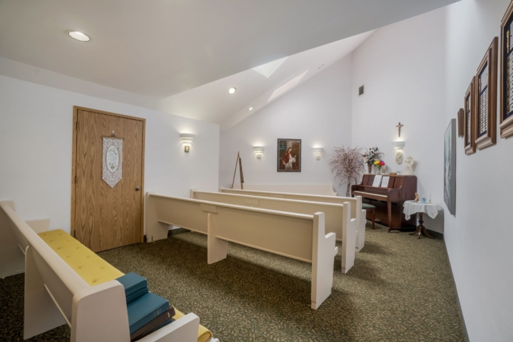 A serene gathering space filled with soft light, inviting pews, and a warm, welcoming atmosphere.