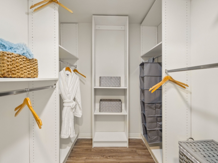 Inviting and organized, this serene closet setting offers comfort and personal space for residents.