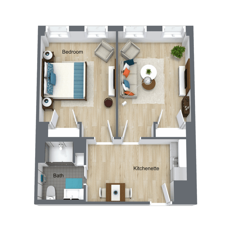 A thoughtfully designed floor plan featuring a spacious bedroom, inviting living area, and kitchenette, fostering comfort and community.