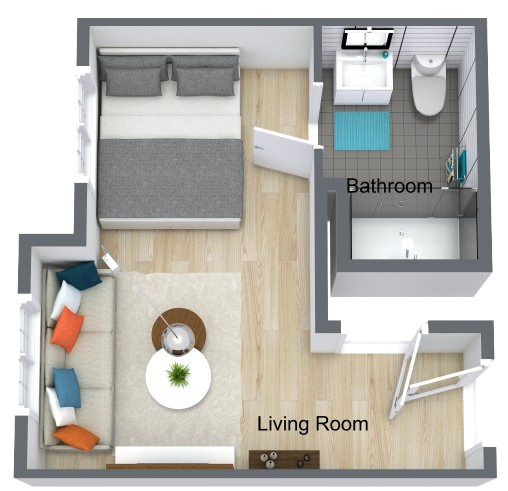 Bright, well-organized living space with comfortable seating, a small dining area, and an accessible bathroom.