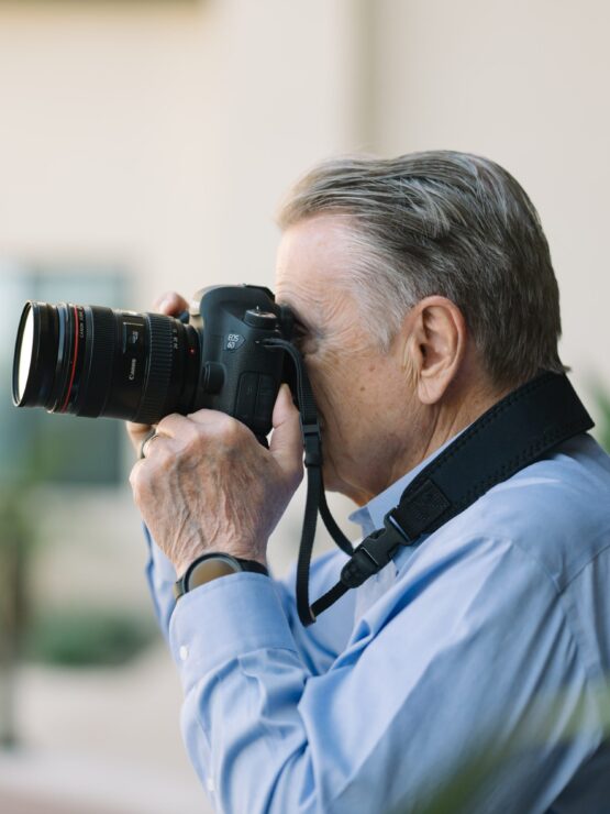 A resident captures joyful moments, surrounded by greenery and a welcoming atmosphere.