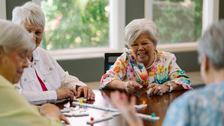 Lively interactions among friends enjoying games, filled with laughter and warmth in a bright space.
