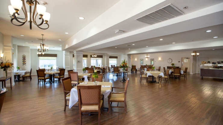 A bright dining area with elegant decor invites warm gatherings and shared moments among residents.