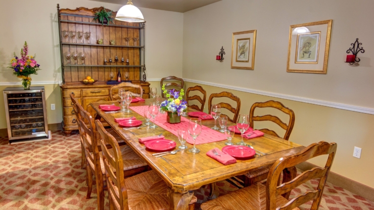 A warm dining space with a beautifully set table invites friendly gatherings and shared meals.