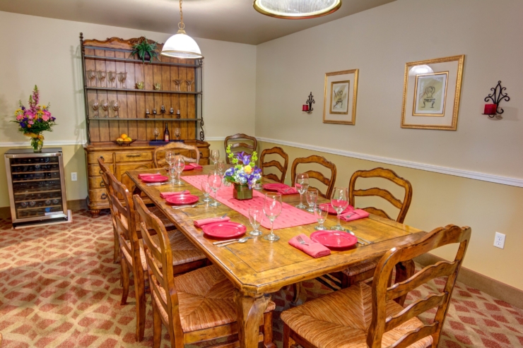 A warm dining space with a beautifully set table invites friendly gatherings and shared meals.